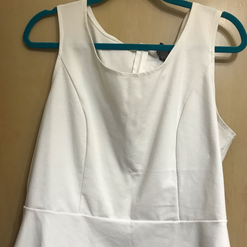 Sleeveless white peplum tank